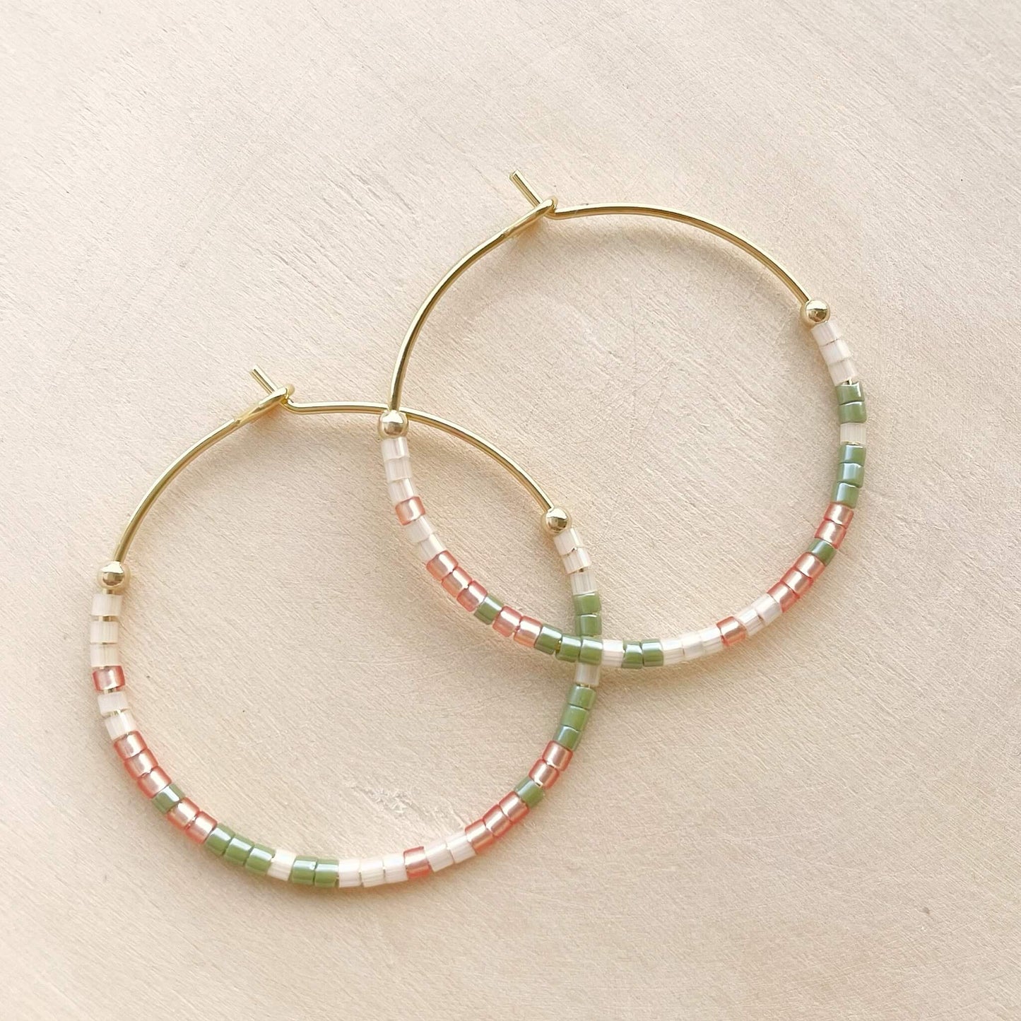 Joshua Tree beaded hoop earrings with golden orange, sage green and apricot glass beads on gold fill hoops