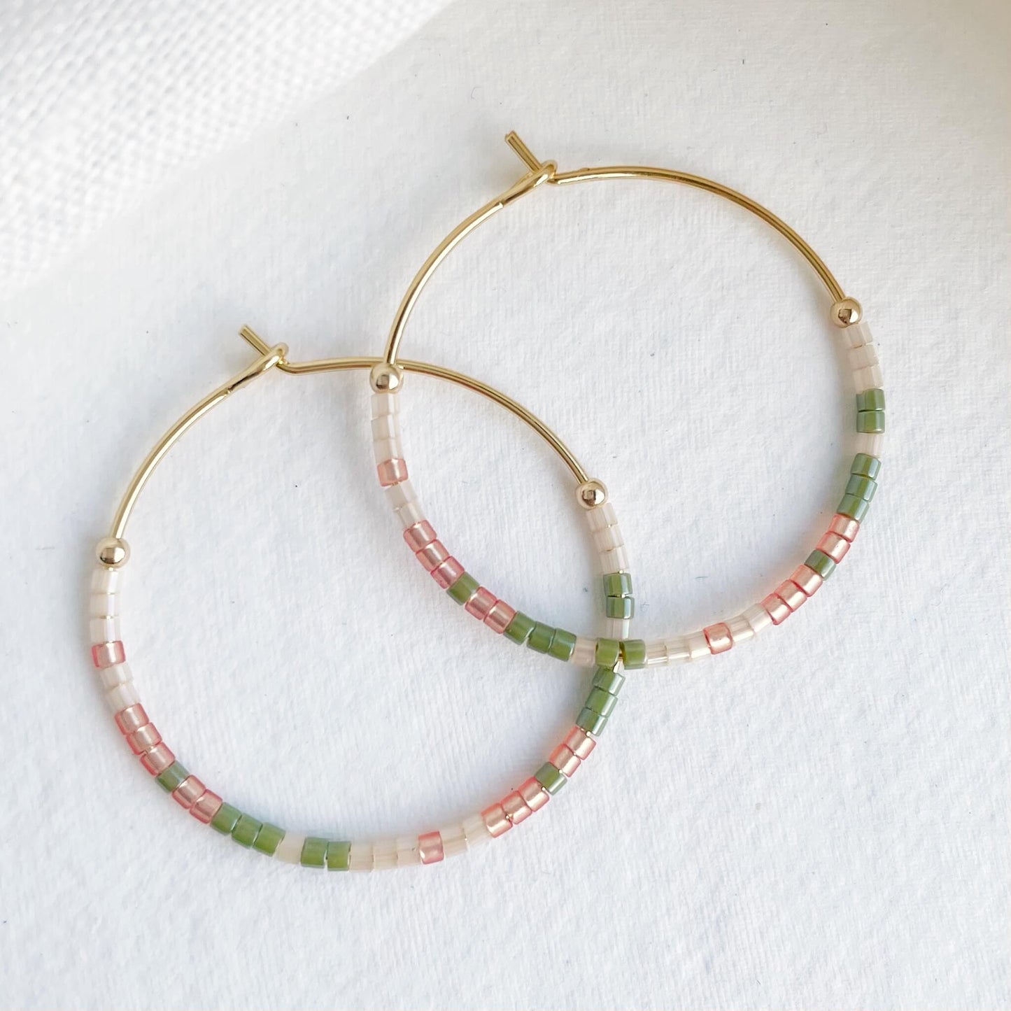 Joshua Tree beaded hoop earrings with golden orange, sage green and apricot glass beads on gold fill hoops