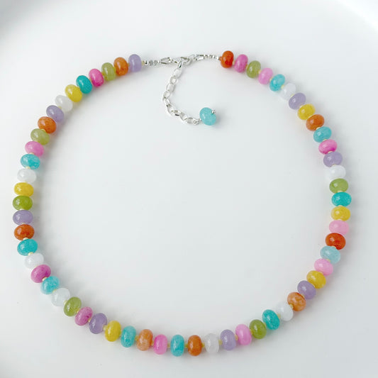 Necklace with multicolored beads on a white background