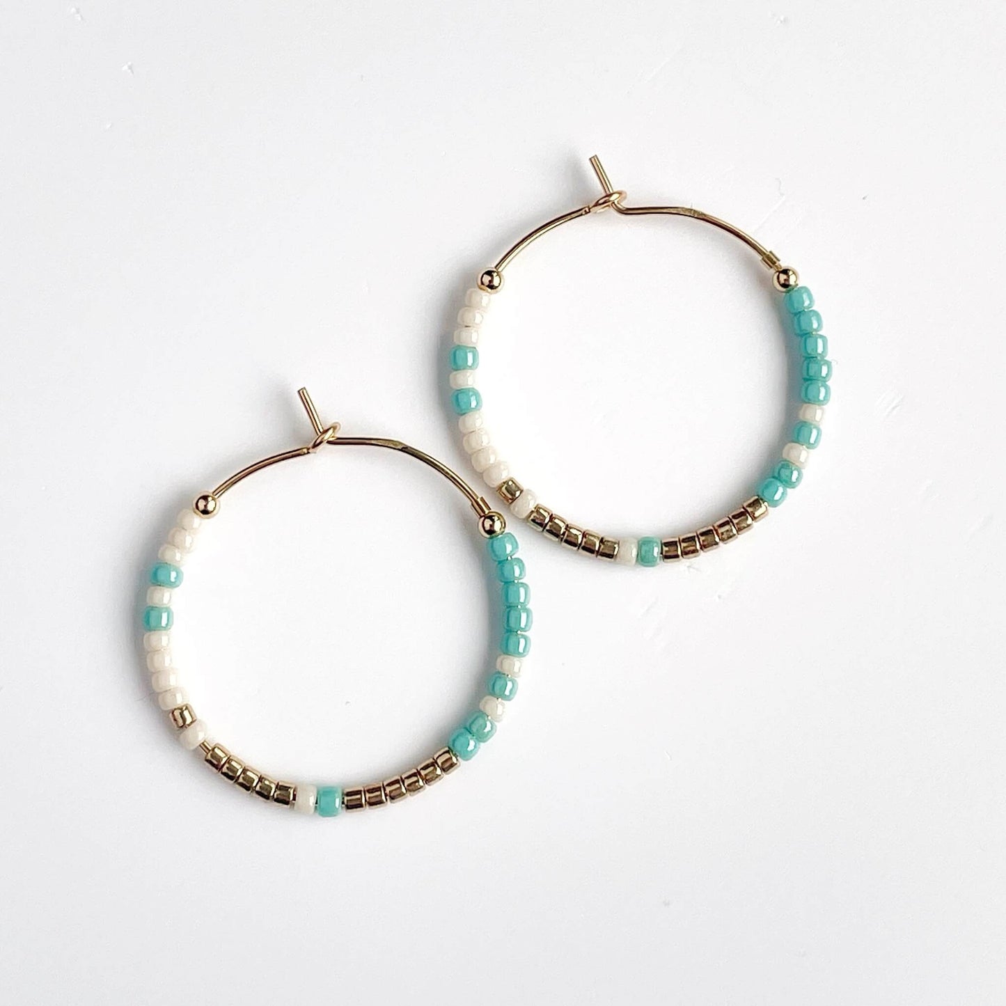 Sandbar small hoop earrings with aqua, gold and linen glass beads on gold fill hoops