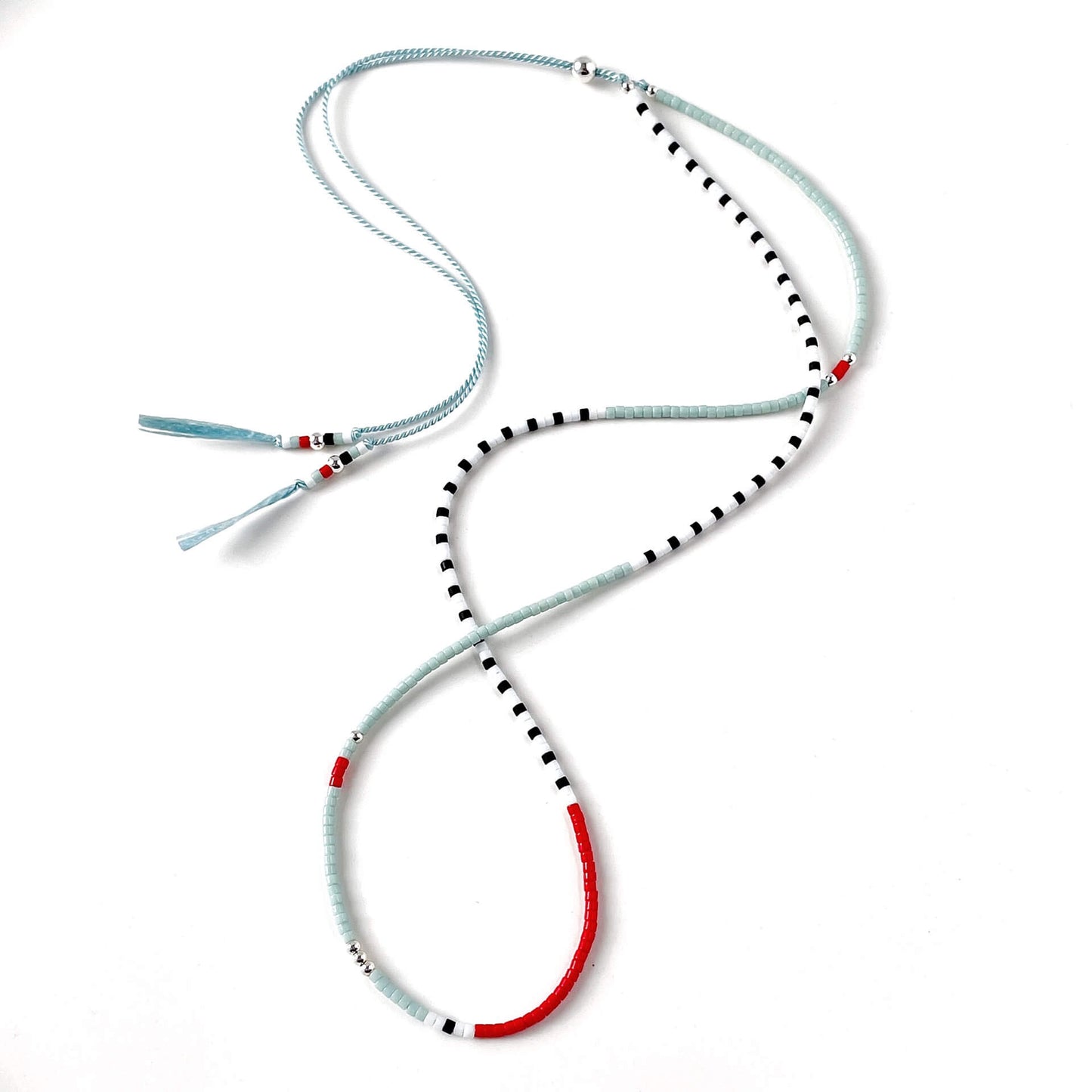 Nautical glass bead necklace with pale blue, white, black and red beads and sterling silver accents on silk cord
