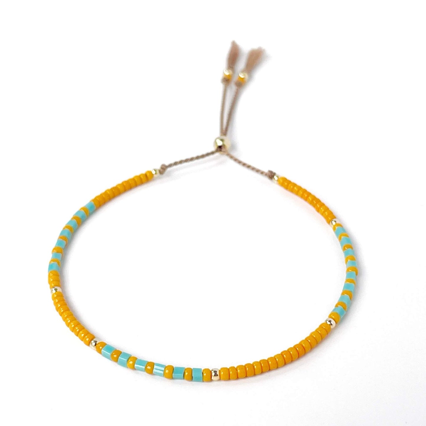 Marrakech adjustable bracelet with burnt orange and turquoise Miyuki beads on beige silk cord with gold fill accents