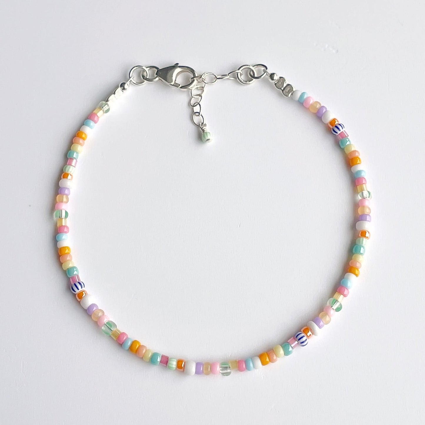 Sterling silver bracelet with multicoloured glass beads in pink, aqua, green, lilac, orange, blue, yellow and white