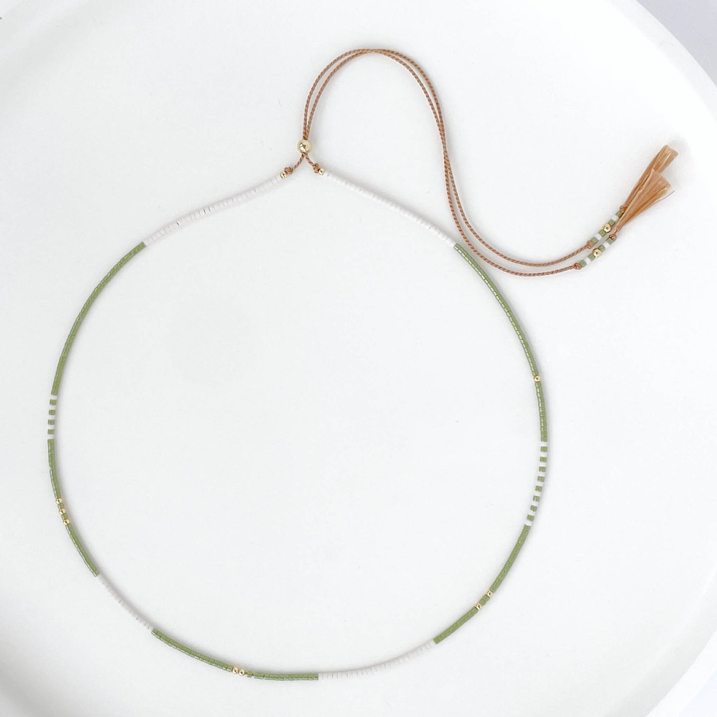 Beaded necklace with moss green and soft white tiny Miyuki beads on beige silk cord with gold fill accents