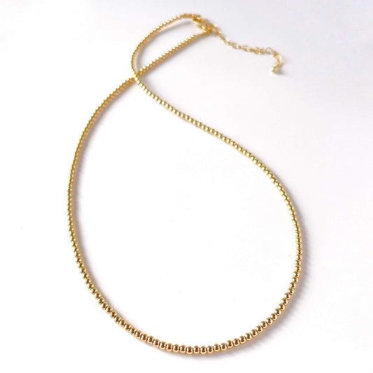 Gold necklace on a white background