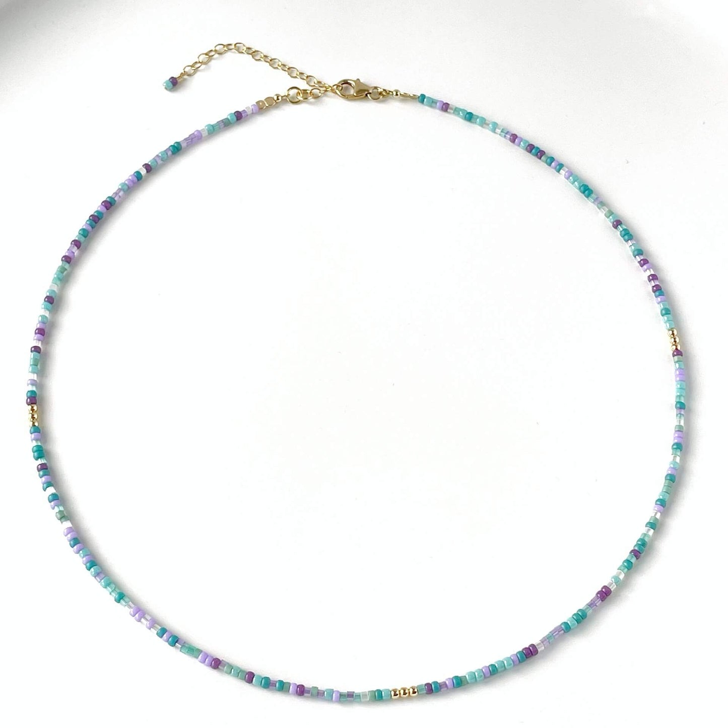 Multicolored beaded necklace on a white background
