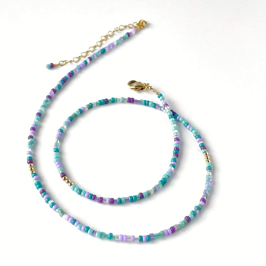 Ocean-inspired glass bead necklace with purple, teal, blue and aqua beads and 14k gold filled accents