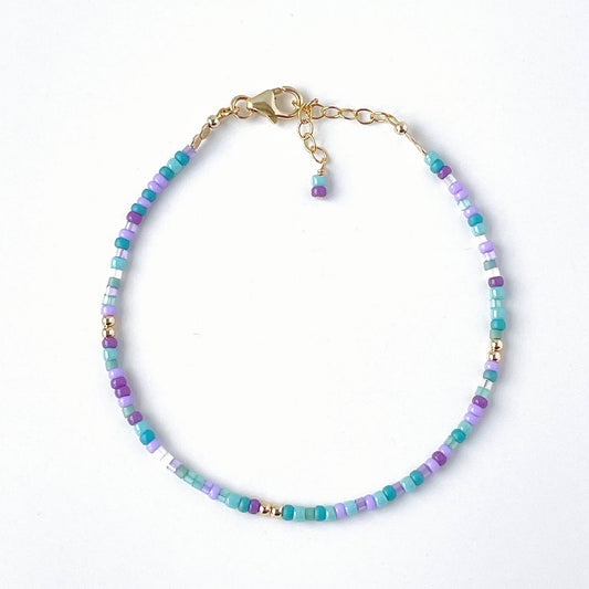 Ocean-inspired glass bead bracelet with purple, teal, blue and aqua beads and 14k gold filled accents