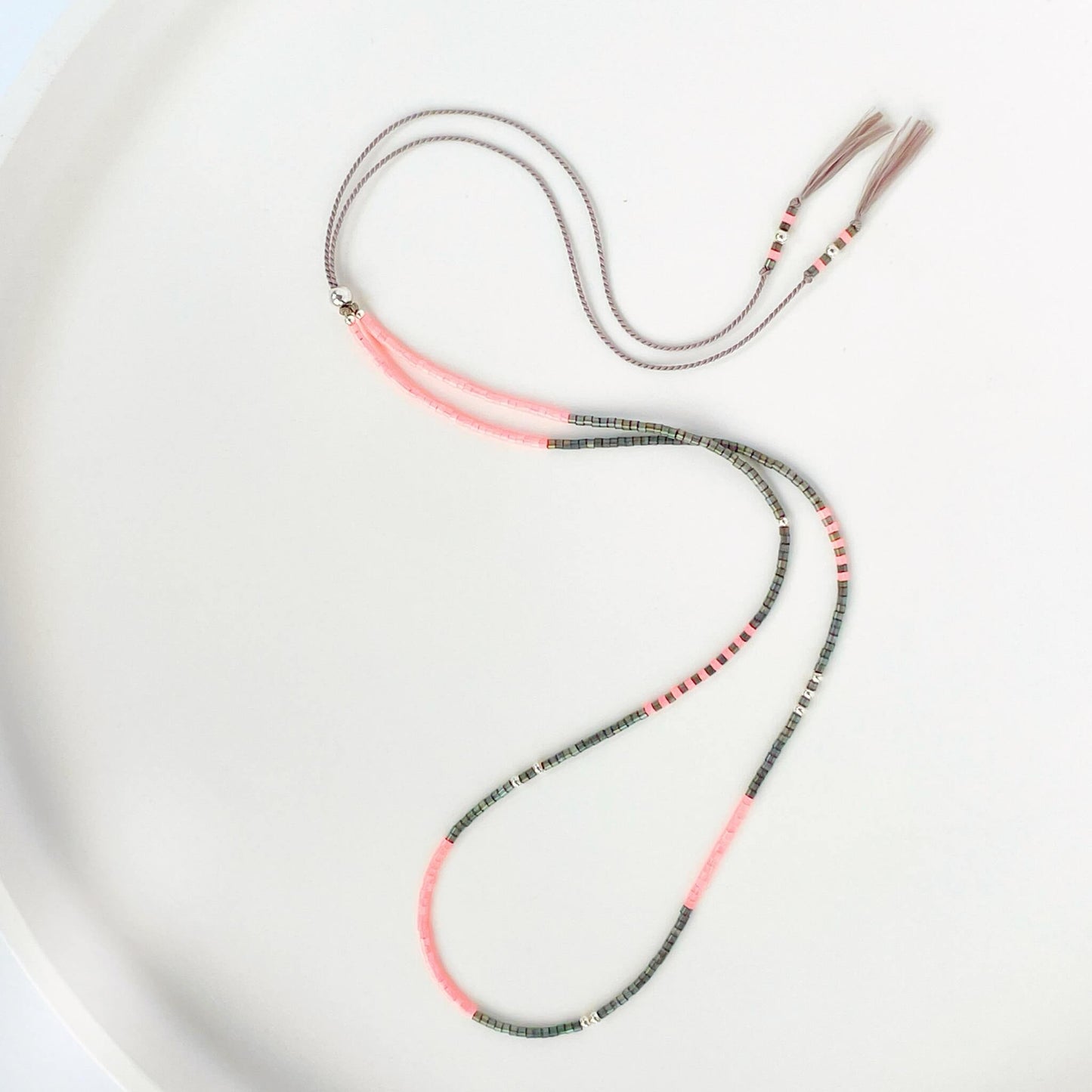 Delicate beaded necklace with grey and bright pink Miyuki beads on grey silk cord with sterling silver accents