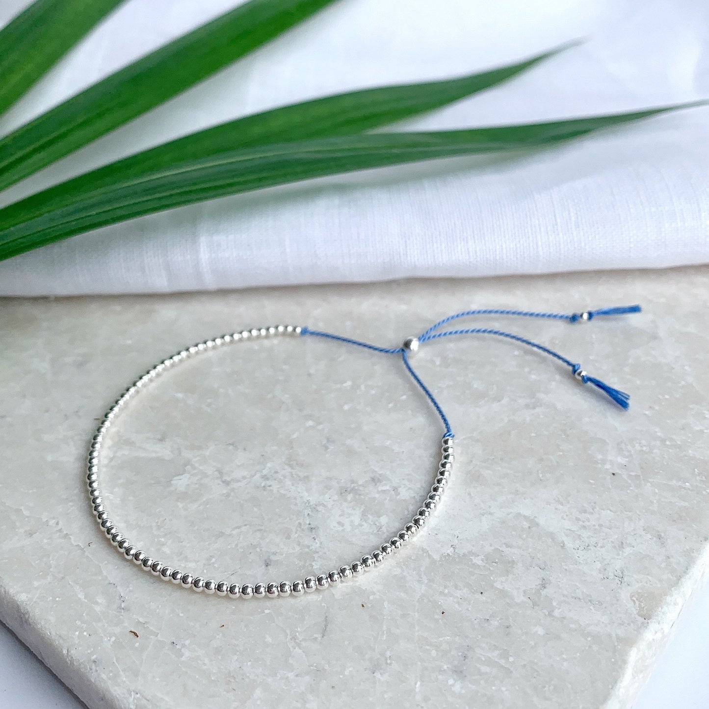 Sterling Silver Beaded Blue Silk Bracelet