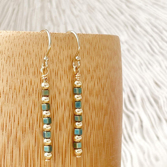 Gold fill drop earrings with square teal glass beads inspired by Statue of Liberty patina