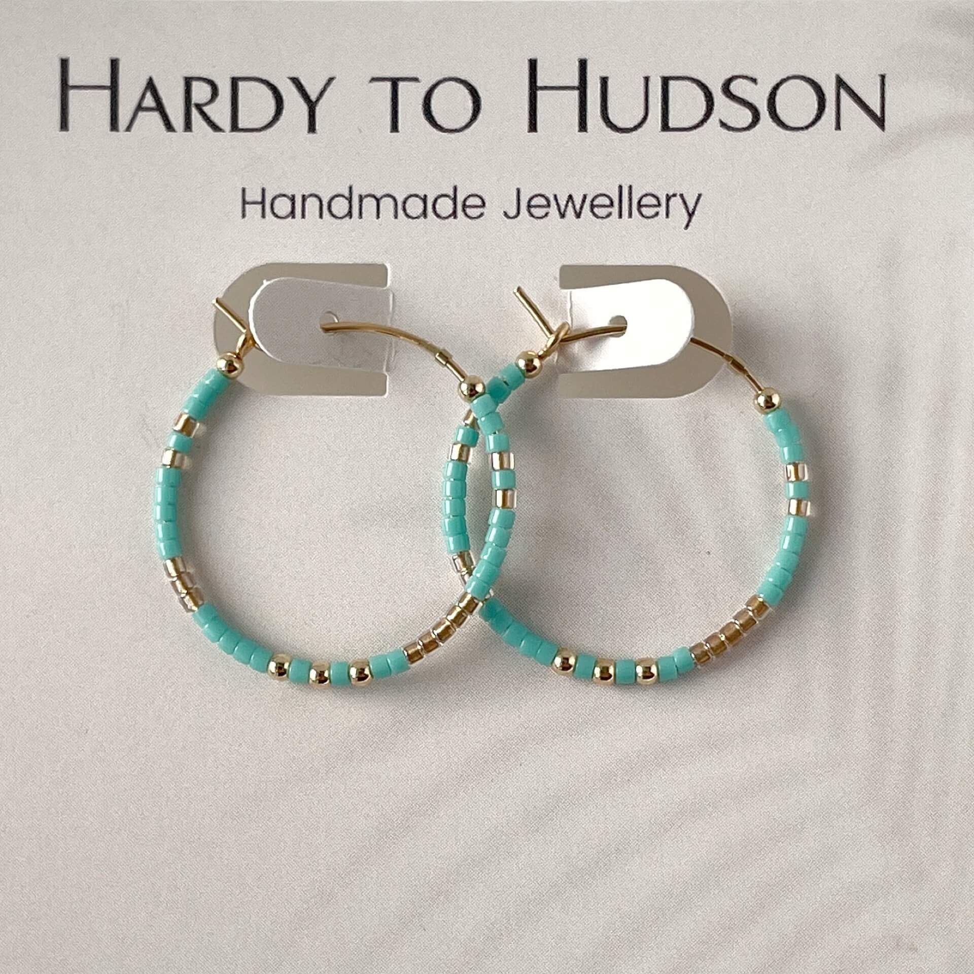Fistral hoop earrings with turquoise and gold glass beads and gold fill accents