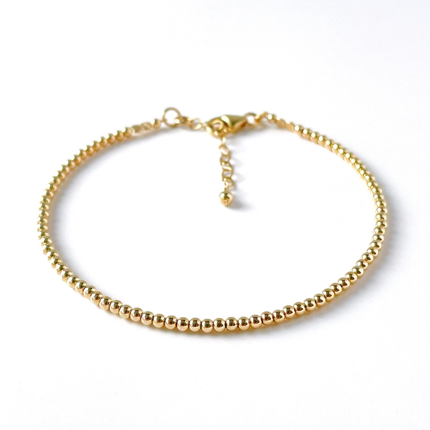 dainty gold beaded bracelet with 2mm gold filled beads and adjustable chain