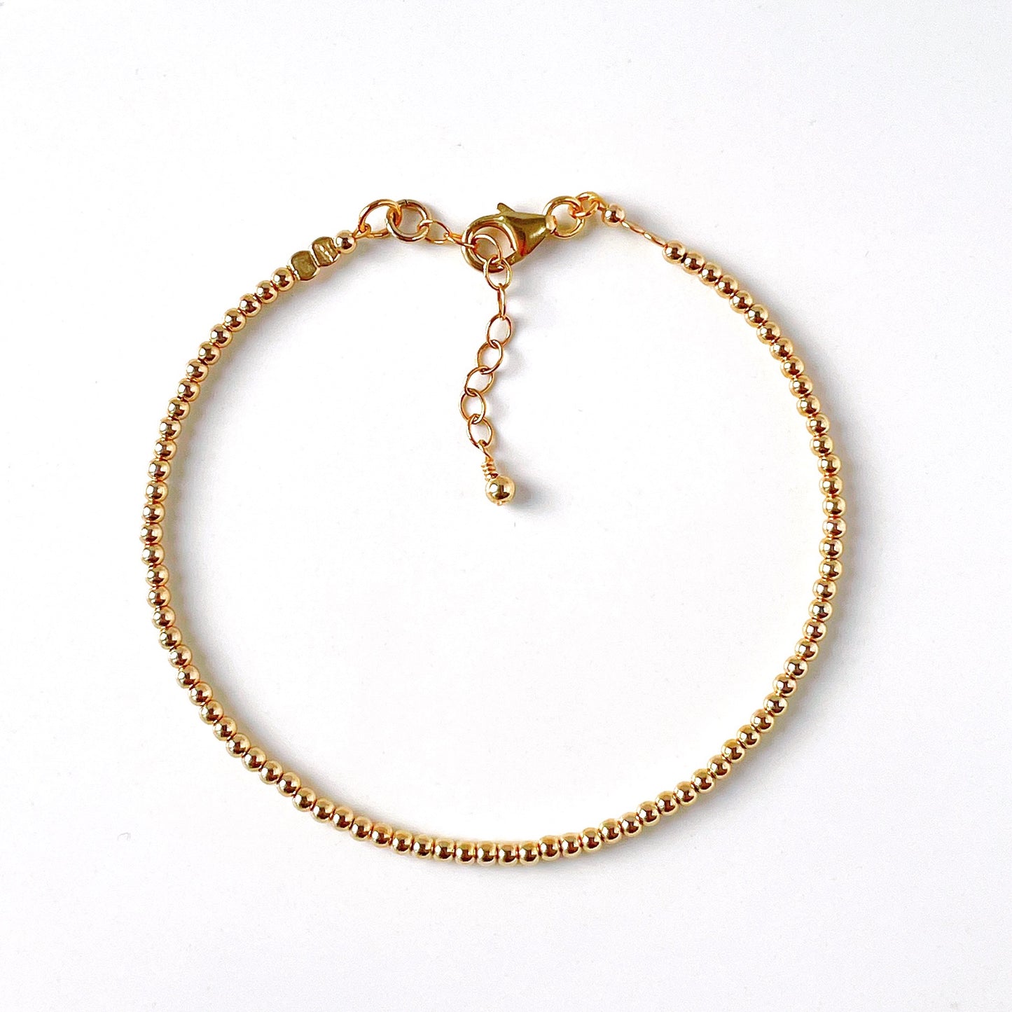 Minimalist gold beaded bracelet with 2mm gold filled beads and adjustable chain