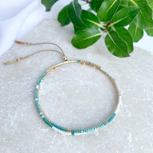 Double wrap bracelet with green, gold and white beads and gold fill accents