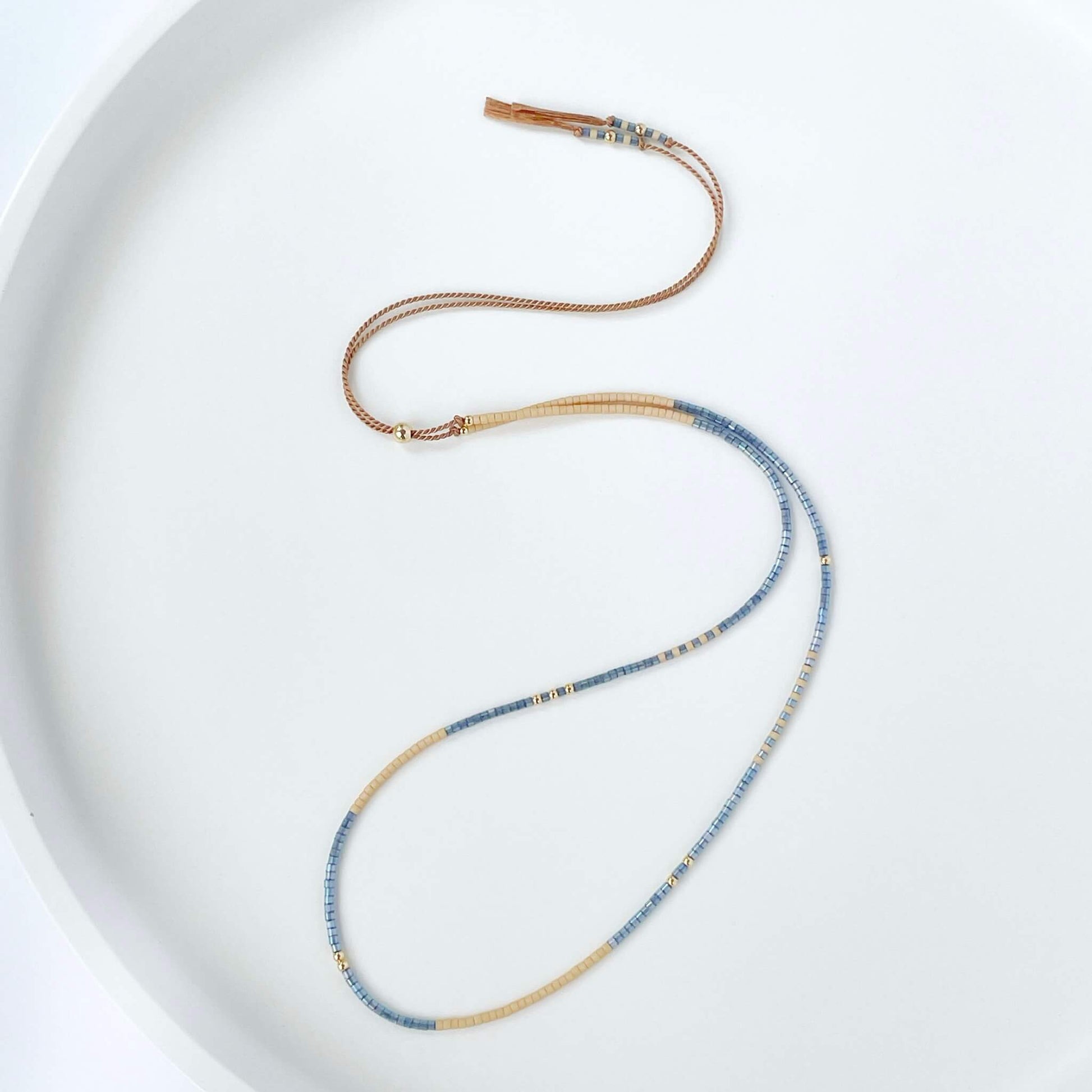 Boho necklace with denim blue and sandy beige Miyuki beads on beige silk cord with gold fill accents