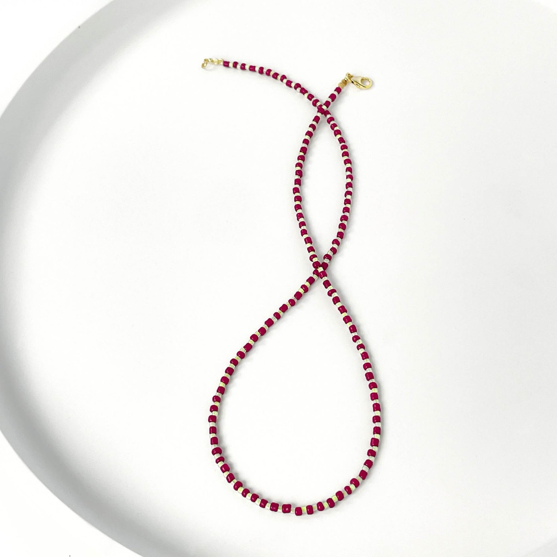 Beaded necklace with burgundy and citrus yellow glass beads and gold filled clasp