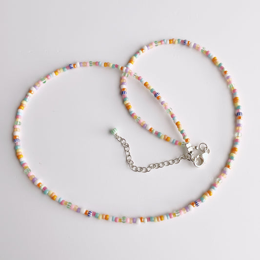 Sterling silver accent beads and tropical colored 2mm glass beads detail on rainbow summer necklace