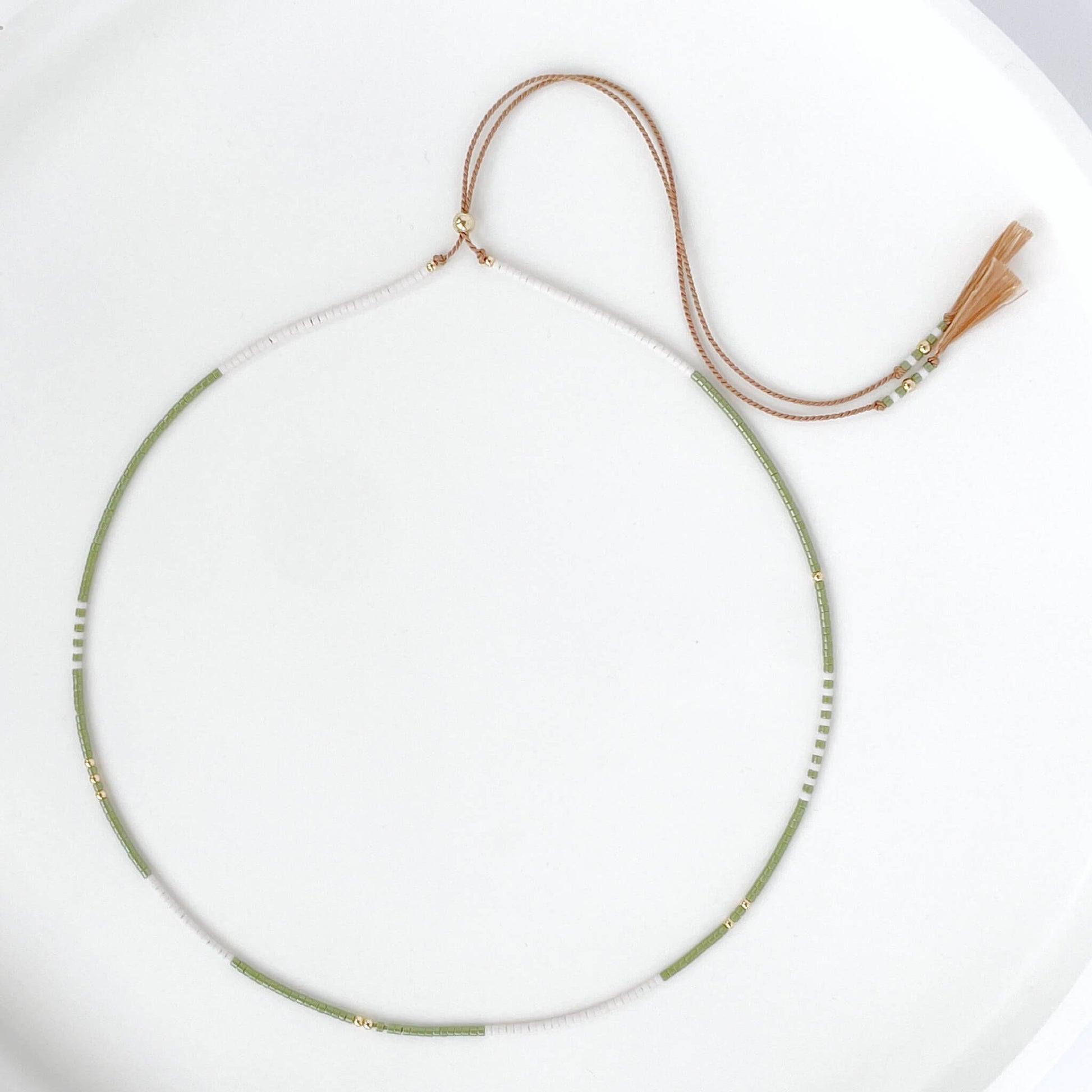 Beaded necklace with moss green and soft white tiny Miyuki beads on beige silk cord with gold fill accents