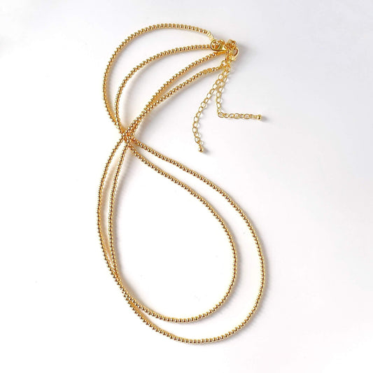2 gold filled necklaces with extender chains  on a white background