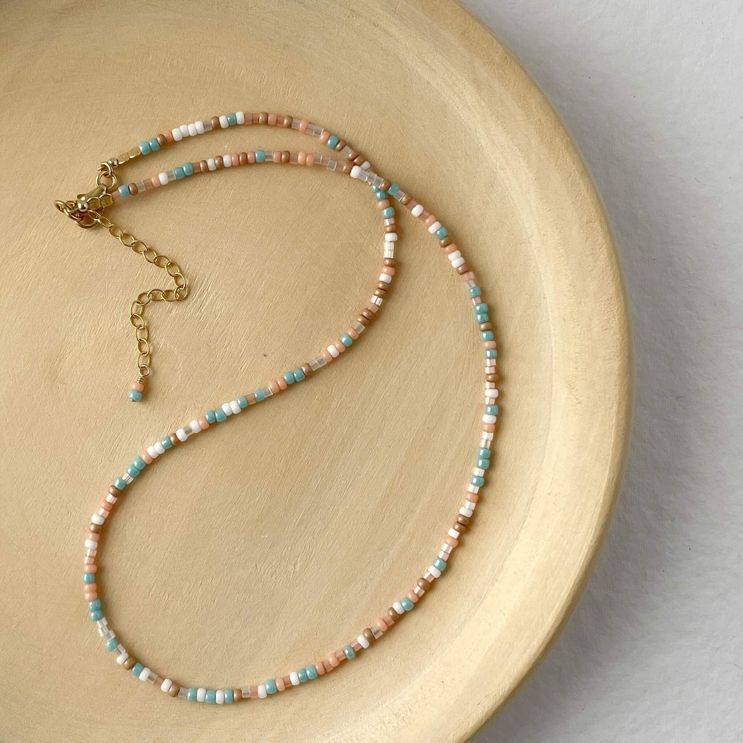 Beaded necklace on a wooden surface