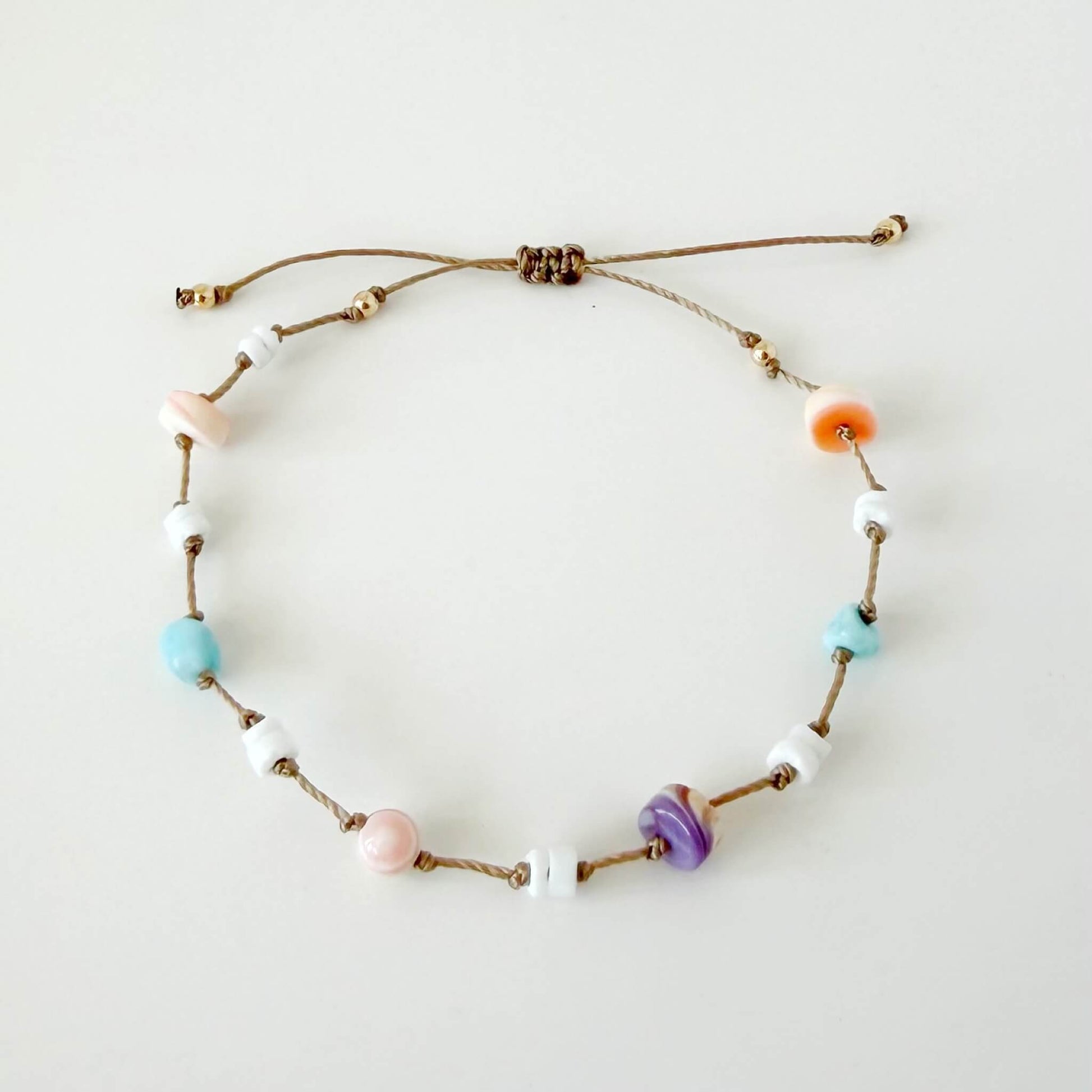 Necklace with colorful beads on a white background