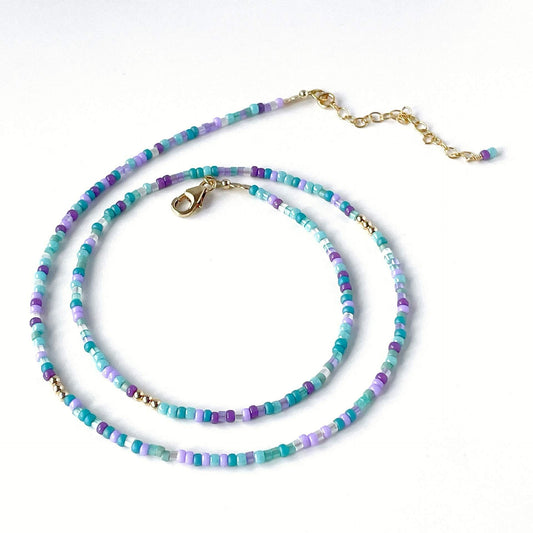 14k gold filled accent beads and colorful ocean-inspired glass beads on flexible stainless steel wire