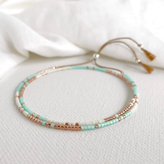 Tarifa double wrap bracelet with green aqua, white and copper glass beads with silver accents