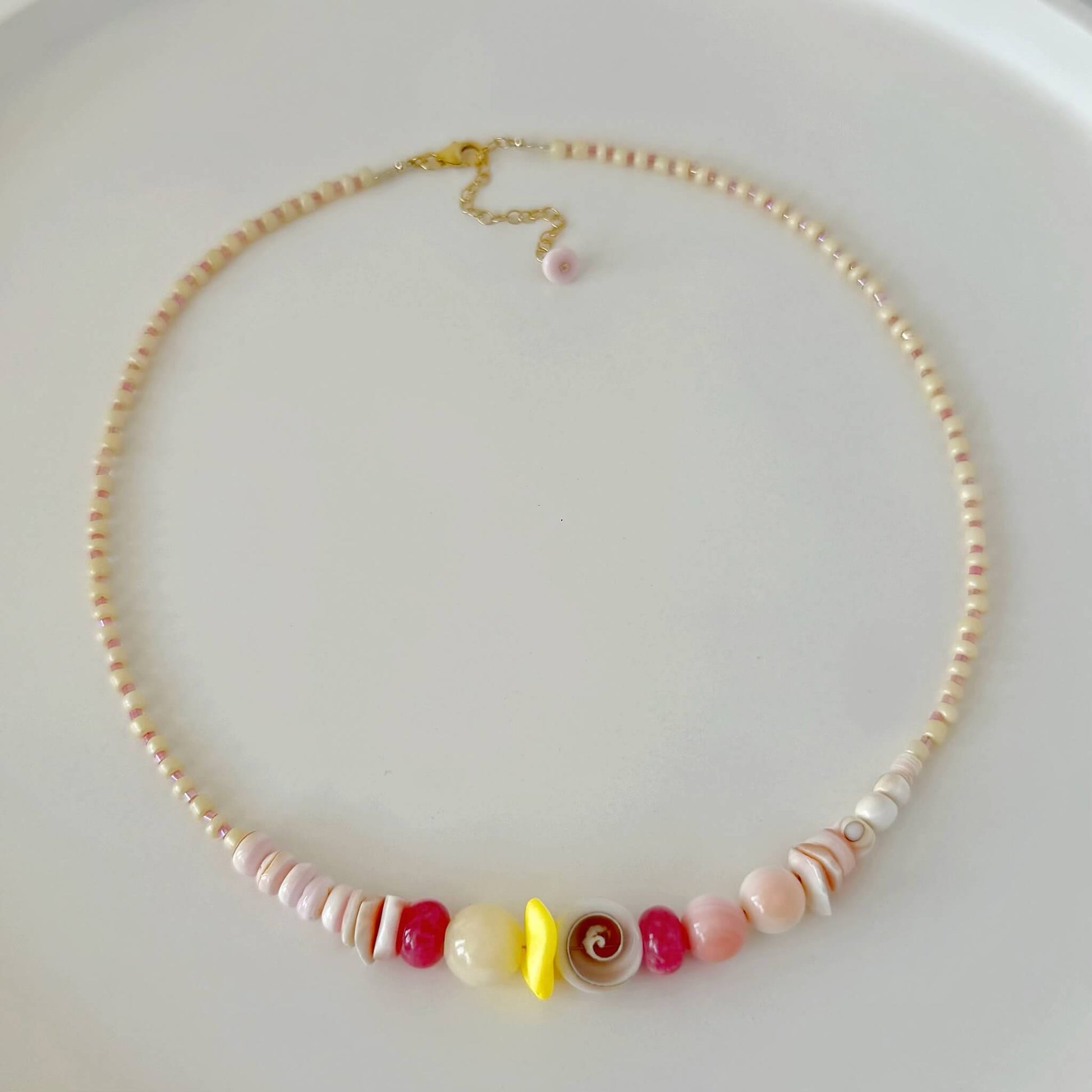Necklace with colorful beads on a white background